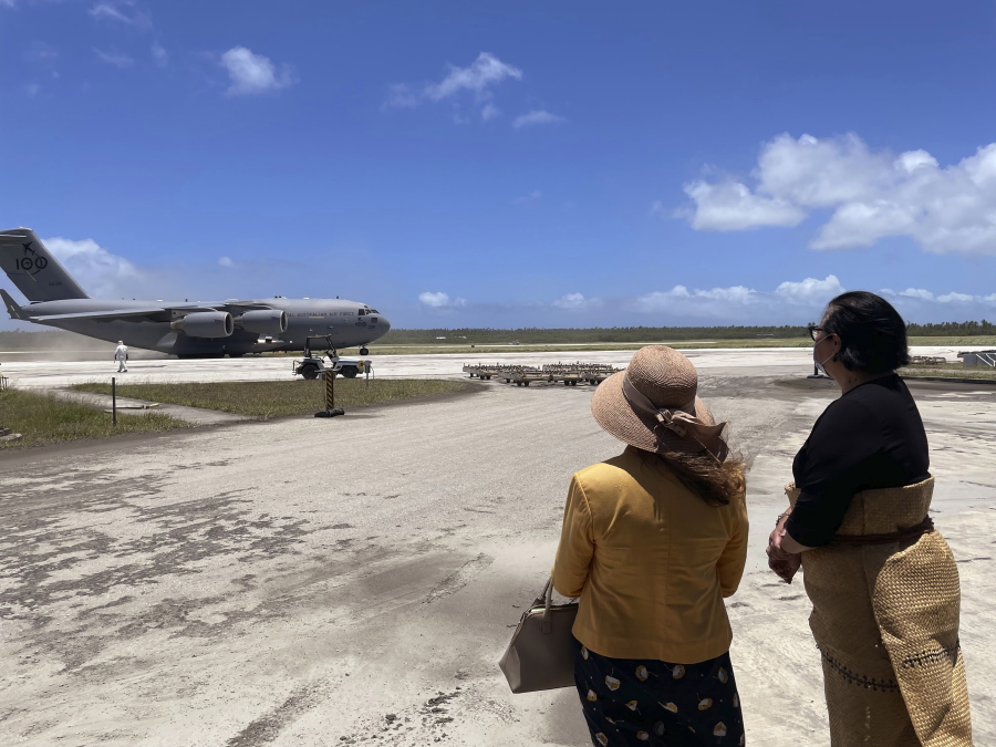 Tongan Foreign Minister Fekitamoeloa 'Utoikamanu, right, and the Australian High Commissioner to Tonga, Rachael Moore, watch the arrival of the first Royal Australian Air Force C-17A Globemaster III aircraft at Fua'amotu International Airport near Nukualofa, Tonga, on Thursday.