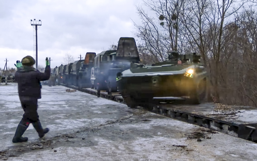 In this photo taken from video provided by the Russian Defense Ministry Press Service, A Russian armored vehicle drives off a railway platform after arrival in Belarus, Wednesday, Jan. 19, 2022. In a move that further beefs up forces near Ukraine, Russia has sent an unspecified number of troops from the country's far east to its ally Belarus, which shares a border with Ukraine, for major war games next month. The Biden administration is unlikely to answer a further Russian invasion of Ukraine by sending U.S. combat troops. But it could pursue a range of less dramatic yet still risky options, including giving military support to a post-invasion Ukrainian resistance.