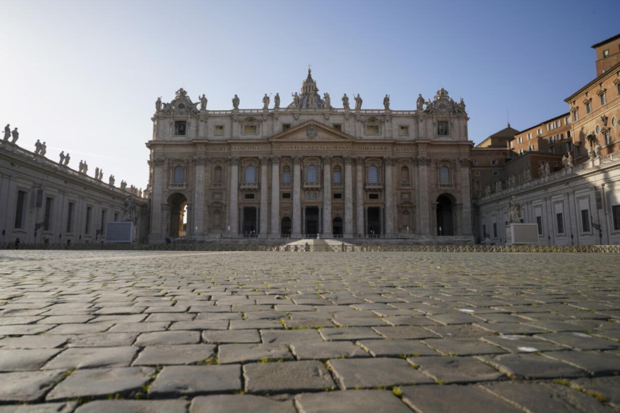 FILE - A view of St. Peter's Basilica at the Vatican, on Nov. 10, 2020. On Tuesday, Nov. 10, 2020. The Vatican said Friday it had completed the sale of a London residential building that is at the heart of a fraud and embezzlement trial under way in the Vatican City State's tribunal, recovering more than it expected from the loss-making investment. The Vatican's economy ministry revealed the sale contract had been signed, and 10% of the deposit received, as it released the Holy See's budget for 2022. It foresees a narrowing of the Holy See's budget deficit to EUR33 million euros from EUR42 million euros last year.