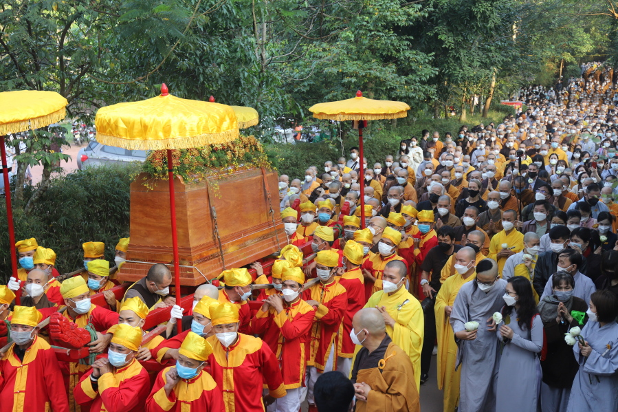 Coffin of Vietnamese Buddhist monk Thich Nhat Hanh is carried to the street during his funeral in Hue, Vietnam Saturday, Jan. 29, 2022. A funeral was held Saturday for Thich Nhat Hanh, a week after the renowned Zen master died at the age of 95 in Hue in central Vietnam.