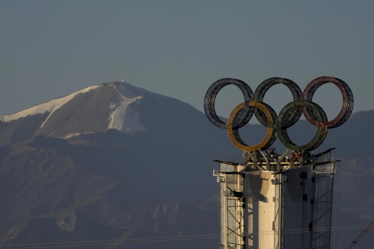Olympic Rings assembled atop of a structure stand out near a ski resort on the outskirts of Beijing, China, Thursday, Jan. 13, 2022. The Chinese capital is gearing up for the Winter Olympics the midst of COVID-19 outbreaks in several Chinese cities which have been locked down.