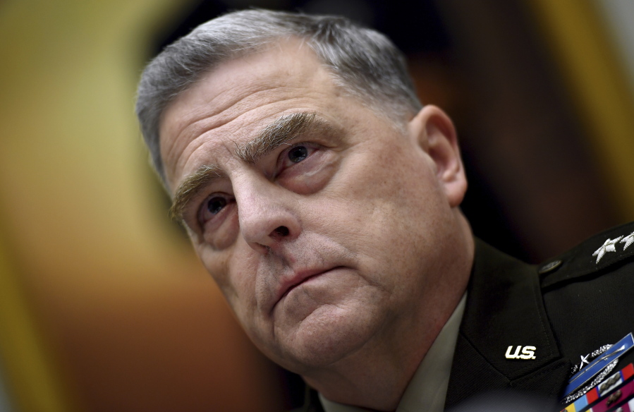 FILE - Gen. Mark Milley, chairman of the Joint Chiefs of Staff, listens during a House Armed Services Committee hearing on the conclusion of military operations in Afghanistan, Sept. 29, 2021, on Capitol Hill in Washington.  Milley has tested positive for COVID-19 and is experiencing very minor symptoms, a spokesperson said Monday.