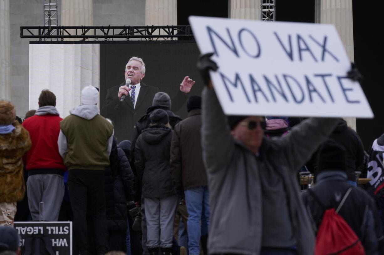 Robert F. Kennedy Jr., is broadcast on a large screen as he speaks during an anti-vaccine rally in front of the Lincoln Memorial in Washington, Sunday, Jan. 23, 2022.