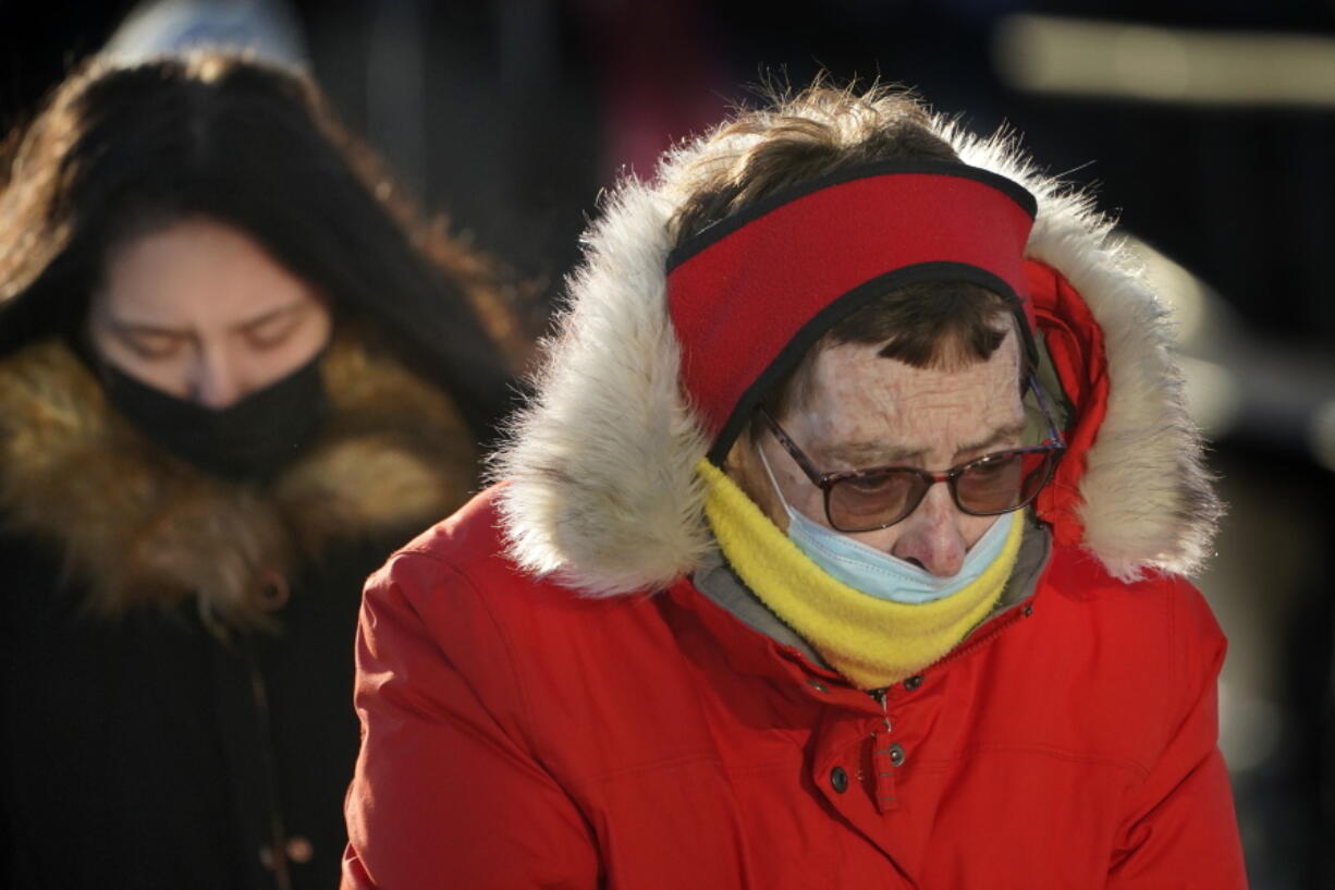 Commuters brave frigid temperatures as they arrive on a ferry, Tuesday, Jan. 11, 2022, in Portland, Maine. Parts of the Northeast are expected to have a wind chill of minus 40 degrees Fahrenheit. (AP Photo/Robert F.