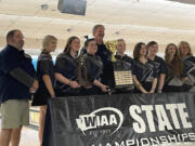 Skyview bowlers and coaches pose for photos with the first-place trophy after winning the Class 4A state championship on Saturday at Narrows Plaza Bowl in University Place.