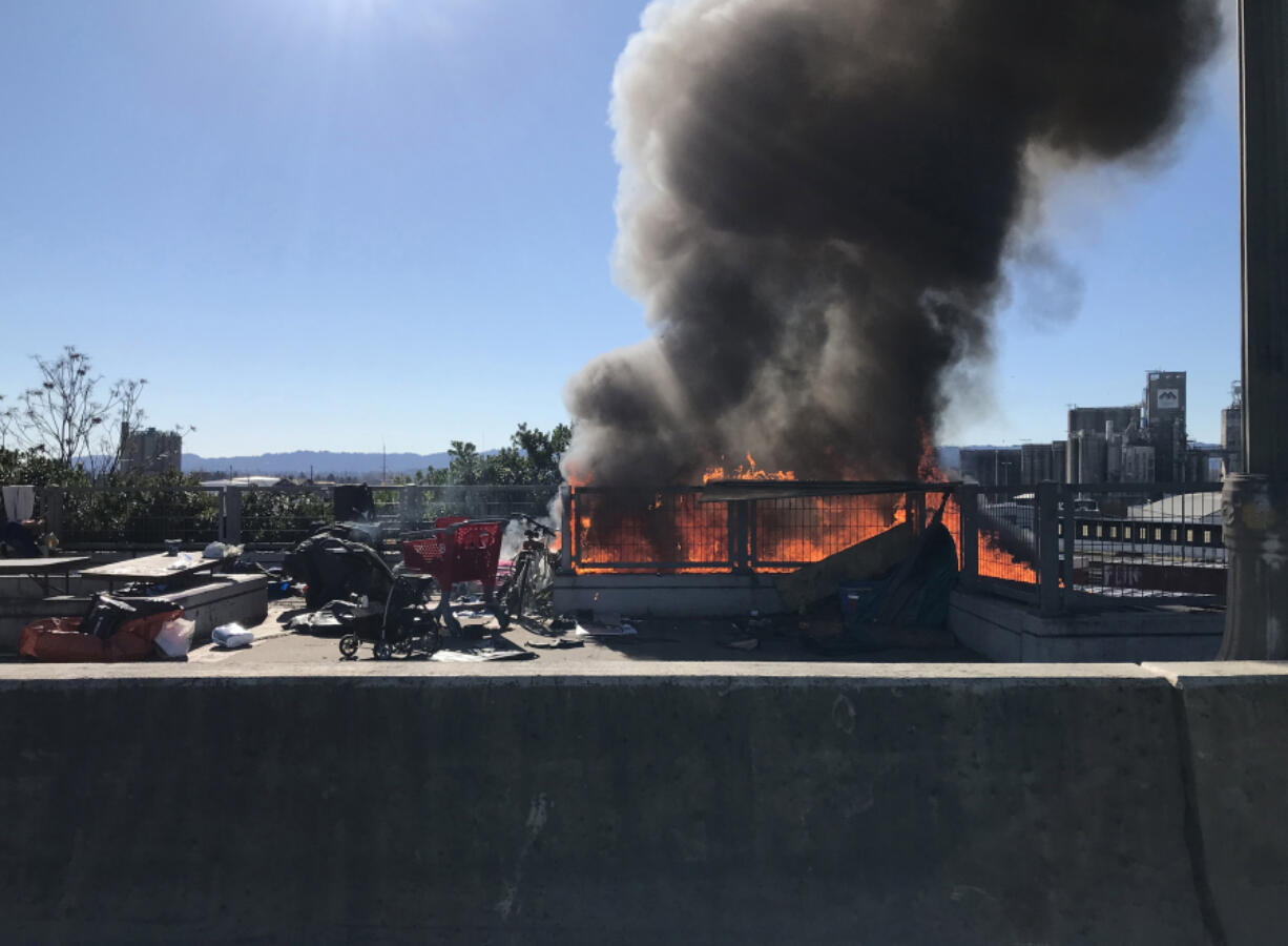 A homeless camp on and below the West Mill Plain Extension Bridge, just west of downtown Vancouver, burned on Saturday afternoon.