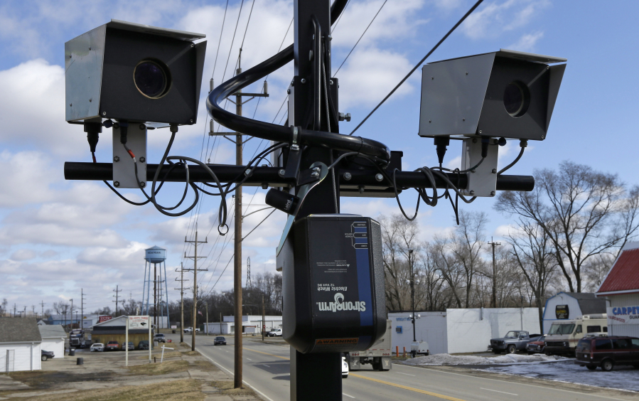 FILE - Speed cameras are aimed at U.S. Route 127, in New Miami, Ohio, Feb. 25, 2014 . Under new federal guidance issued Wednesday, Feb. 2, 2022, states can now tap billions of federal highway dollars for roadway safety programs such as automated traffic enforcement. They are being told that cameras that photograph speeding vehicles are an established way to help bring down rising traffic deaths.