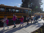 Students at Marrion Elementary School  in Vancouver practice social distancing after getting off the bus at the beginning of the 2021-22 school year.