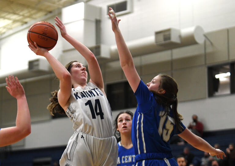 King’s Way senior Laurel Quinn, left, shoots the ball Friday, Feb. 4, 2022, during the Knights’ 45-40 win against the Wildcats at King’s Way Christian High School.