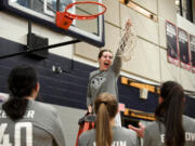 King’s Way senior Laurel Quinn lets out a yell after cutting down the net Friday, Feb. 4, 2022, after the Knights’ 45-40 win against the Wildcats at King’s Way Christian High School. King’s Way became the Trico League co-champion after the win.