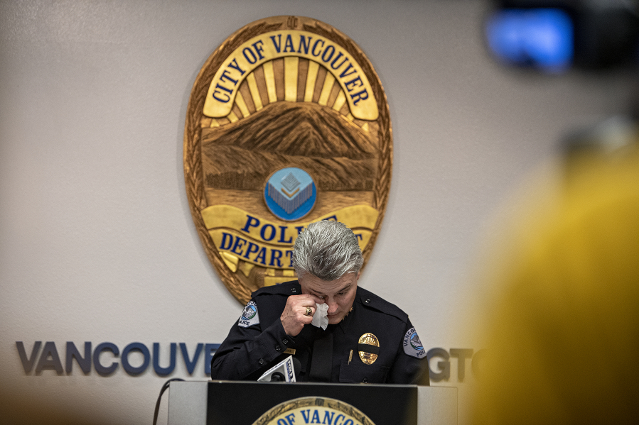 Vancouver police Chief James McElvain wipes away a tear while reading a statement from slain Officer Donald Sahota's mother during a press conference Thursday afternoon at the department's headquarters.