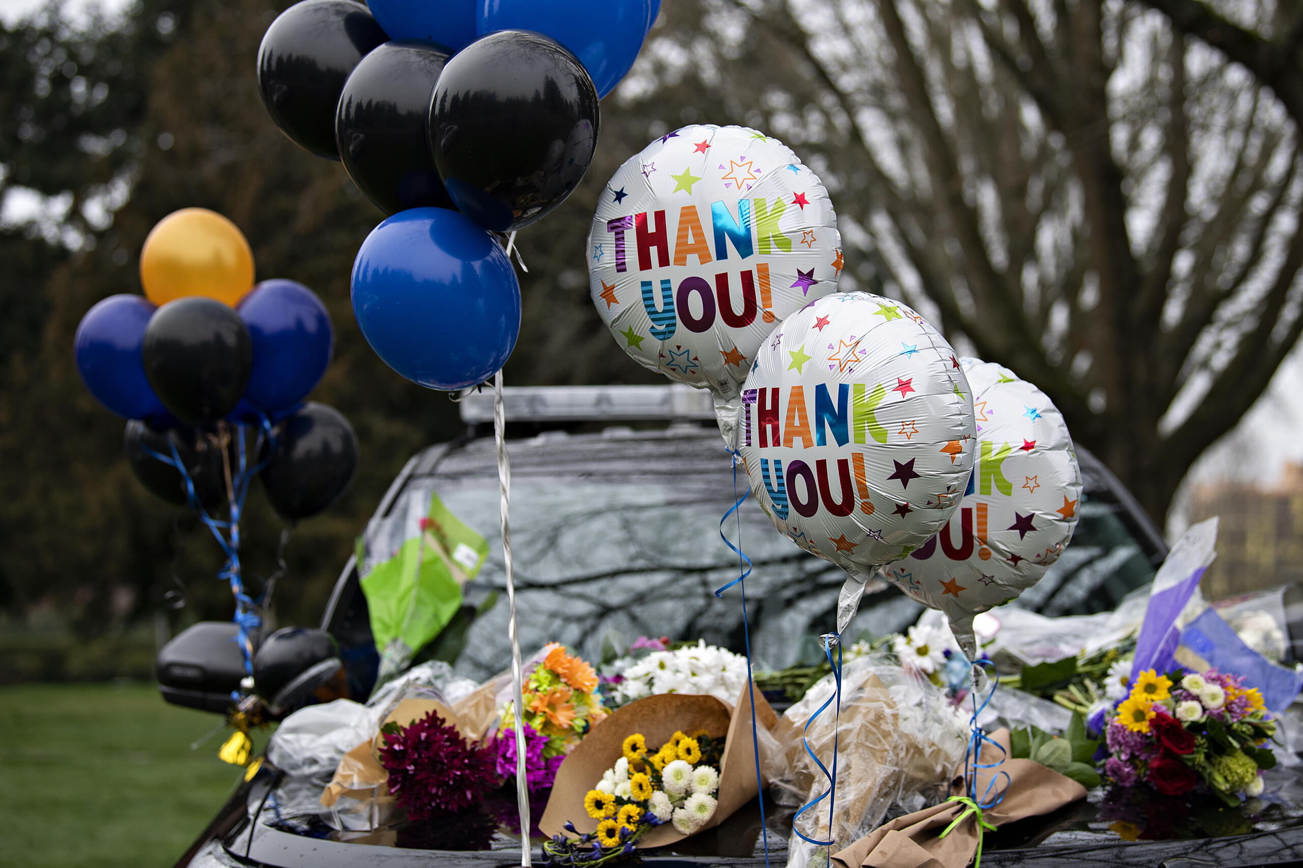 A memorial honors Officer Donald Sahota outside the Vancouver Police Department headquarters Friday morning, Feb. 4, 2022. Sahota, 52, was mistakenly shot at his home near Battle Ground by Clark County sheriffs Deputy Jonathan Feller during a manhunt for a robbery suspect Saturday night.