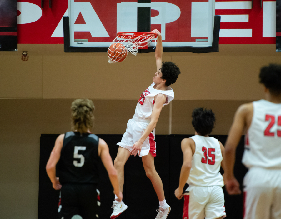 Camas' Stephen Behil throws down a first-half slam against Union in the 4A Greater St. Helens League regular-season finale on Tuesday. Camas won 80-77 to force a tiebreaker game Wednesday.