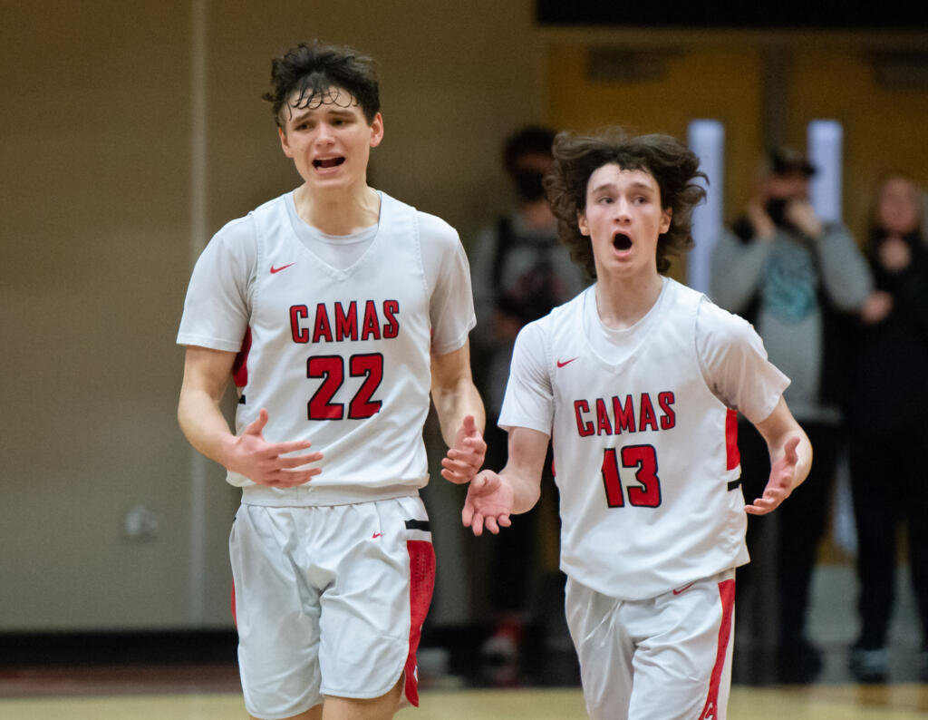 Camas' Carson Frawley and Jace VanVoorhis lament some poor play while heading into a timeout in a 4A Greater St. Helens League boys basketball on Tuesday, Feb. 8, 2022, at Camas High School. Camas won 80-77.