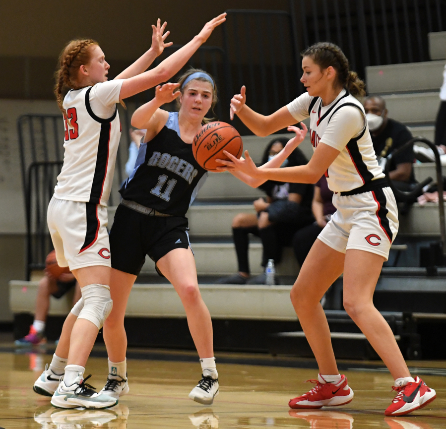 Camas sophomore Reagan Jamison, right, steals the ball from Rogers-Puyallup senior Karinna Tel on Friday, Feb. 11, 2022, during the Papermakers??? 65-34 win against Rogers-Puyallup at Camas High School.