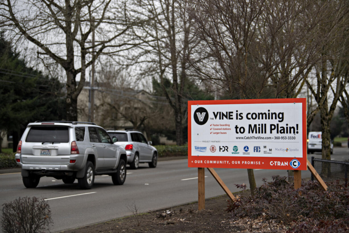 Drivers near the intersection of Southeast Mill Plain Boulevard and Southeast 155th Avenue pass a sign advertising the future C-Tran VINE construction along the corridor. Construction is expected to take about 20 months.