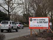 Drivers near the intersection of Southeast Mill Plain Boulevard and Southeast 155th Avenue pass a sign advertising the future C-Tran VINE construction along the corridor. Construction is expected to take about 20 months.
