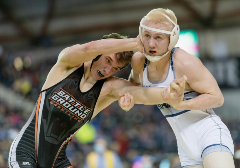 Battle Ground's Gunnar Henderson pushes away Chiawana's Lance Stover in a first-round battle at Mat Classic XXXIII on Friday, Feb. 18, at the Tacoma Dome.