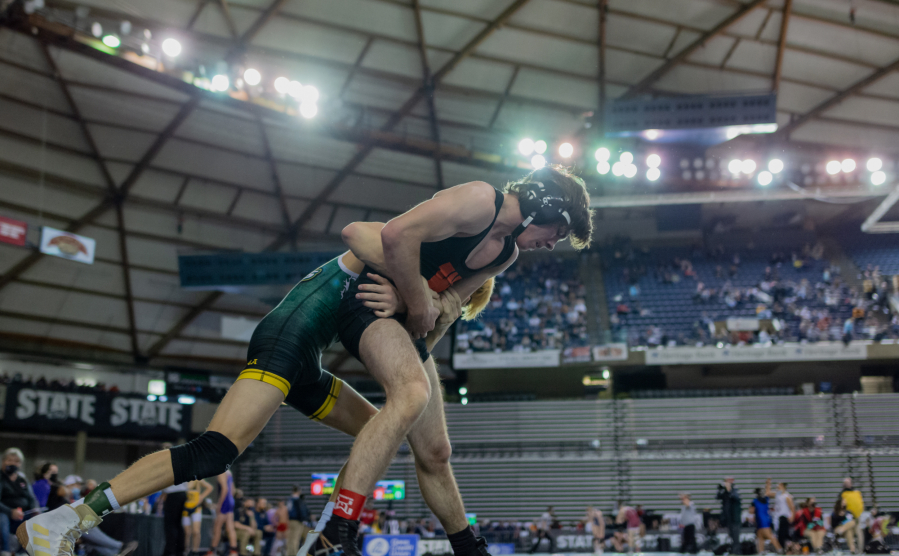 Washougal's Lucas Golphenee defends a takedown against Lynden's Kaleb Oostra in a quarterfinal victory at Mat Classic XXXIII on Friday, Feb. 18, at the Tacoma Dome.