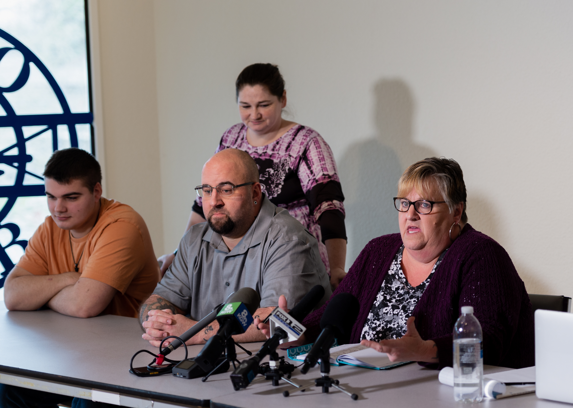 From left, Logan Shorthill, Misty Shorthill and Josh Shorthill listen on while Sue Zawacki, Jenoah Donald's mother, speaks at a press conference on Thursday, Feb. 17, at the Aero Club in Salmon Creek. The family of Jenoah Donald, who was fatally shot by a Clark County Sheriff's deputy last February, held the press conference to answer questions regarding the wrongful death claim they filed in June.