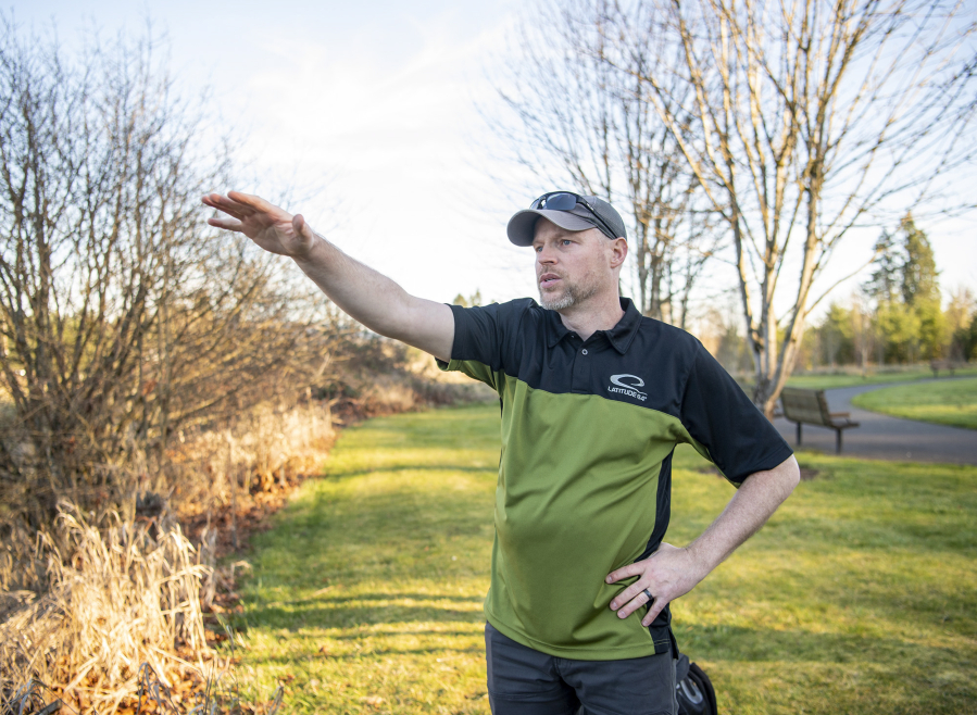 Josh Dearing, an avid disc golf player from Vancouver, gestures to the planned site of an 18-hole disc golf course he helped design at Hockinson Meadows Community Park. The new course is expected to open later this summer.