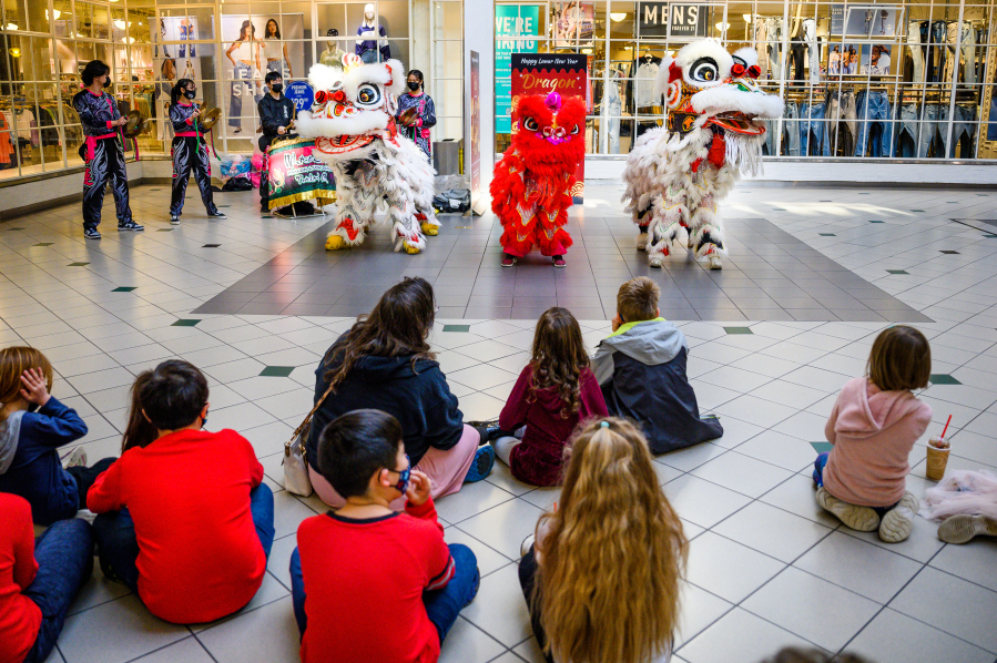 White Lotus group performs a lion dance Saturday at Vancouver Mall to celebrate Lunar New Year. Lion dances are performed to chase away evil spirits and welcome prosperity and luck for the new year. (Molly J.