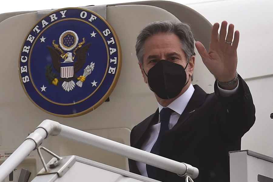 United States' Secretary of State Antony Blinken waves as he disembarks from his plane in Melbourne, Australia, Wednesday, Feb. 9, 2022.