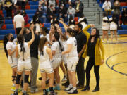 The Hudson's Bay girls basketball team celebrates their 33-30 win over W.F.