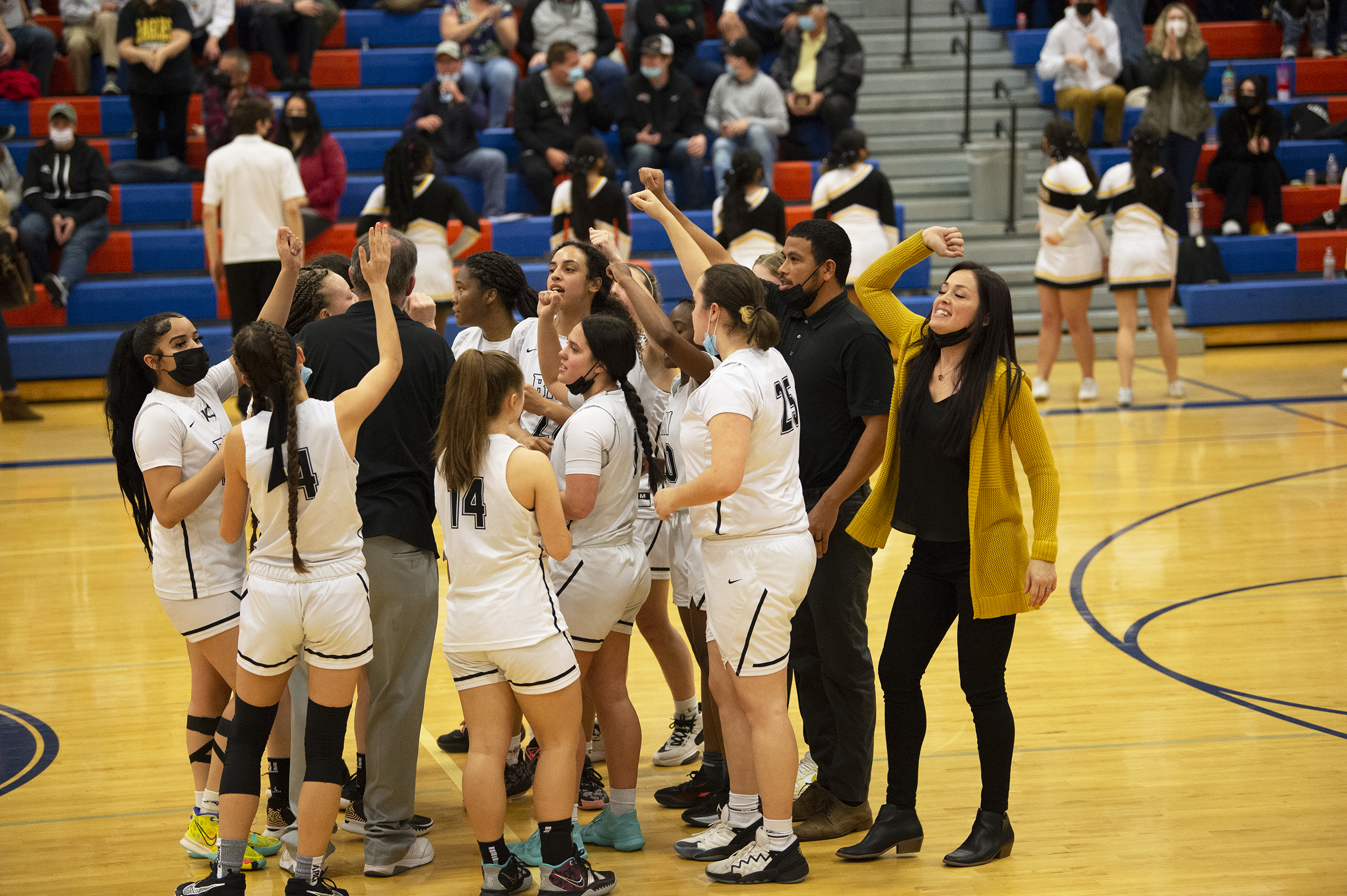 The Hudson's Bay girls basketball team celebrates their 33-30 win over W.F.