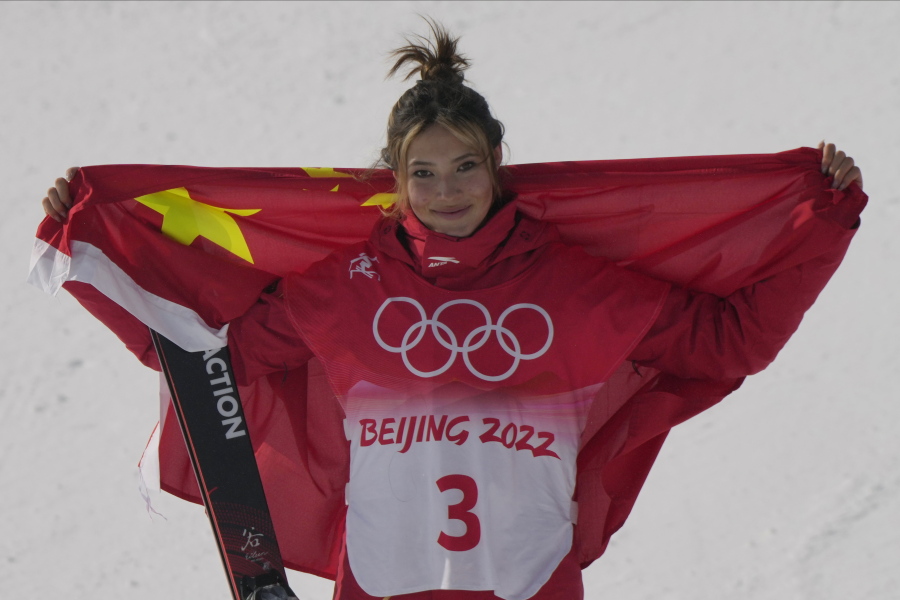 Silver medal winner China's Eileen Gu celebrates during the venue award ceremony for the women's slopestyle finals Tuesday in Zhangjiakou, China.
