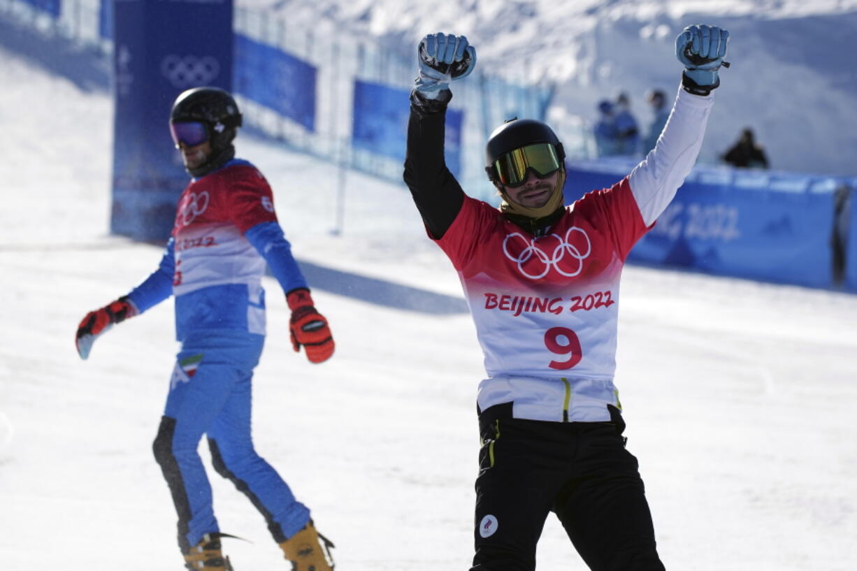 Victor Wild, of the Russian Olympic Committee, reacts after winning a bronze medal in the men's parallel giant slalom at the 2022 Winter Olympics, Tuesday, Feb. 8, 2022, in Zhangjiakou, China.