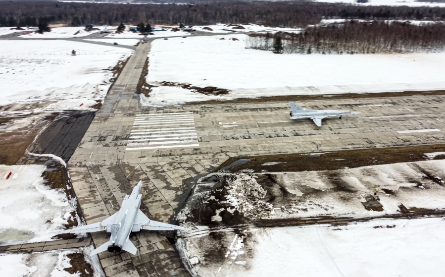 In this photo taken from video and released by the Russian Defense Ministry Press Service on Saturday, Feb. 5, 2022, A pair of Tu-22M3 bombers of the Russian air force taxi before takeoff at an air base in Russia. Two Tu-22M3 long-range bombers of the Russian air force performed a patrol mission over Belarus on Saturday amid the tensions over Ukraine.