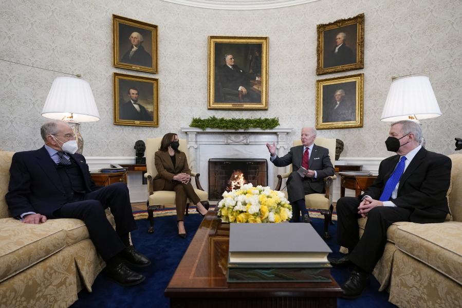 President Joe Biden and Vice President Kamala Harris meet with Sen. Dick Durbin, D-Ill., right, chairman of the Senate Judiciary Committee, and Sen. Chuck Grassley, R-Iowa, the ranking member, to discuss the upcoming Supreme Court vacancy in the Oval Office of the White House, Tuesday, Feb. 1, 2022, in Washington.
