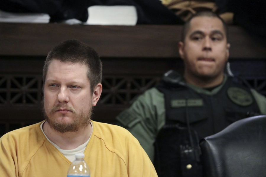 FILE - Chicago police Officer Jason Van Dyke, left, attends his sentencing hearing at the Leighton Criminal Court Building in Chicago, for the 2014 shooting of Laquan McDonald, Jan. 18, 2019. Van Dyke is scheduled to be released from prison on Thursday, Feb. 3, 2022, after he served less than half of his 81-month sentence.
