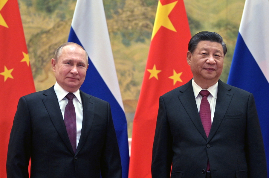 Chinese President Xi Jinping, right, and Russian President Vladimir Putin pose for a photo prior to their talks in Beijing, China, Friday, Feb. 4, 2022. Putin on Friday arrived in Beijing for the opening of the Winter Olympic Games and talks with his Chinese counterpart Xi Jinping, as the two leaders look to project themselves as a counterweight to the U.S. and its allies.