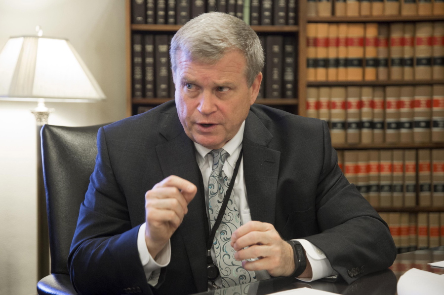 FILE - In this March 1, 2017, file photo, Idaho Attorney General Lawrence Wasden speaks during an interview in Boise, Idaho. The false claims that the 2020 election was stolen from former President Donald Trump and protecting future election results loom large over this year's races for state attorneys general. Candidates who support Trump's position are angling to unseat Democratic incumbents in political swing states - and in some cases, knock out moderate attorneys general in GOP primaries.