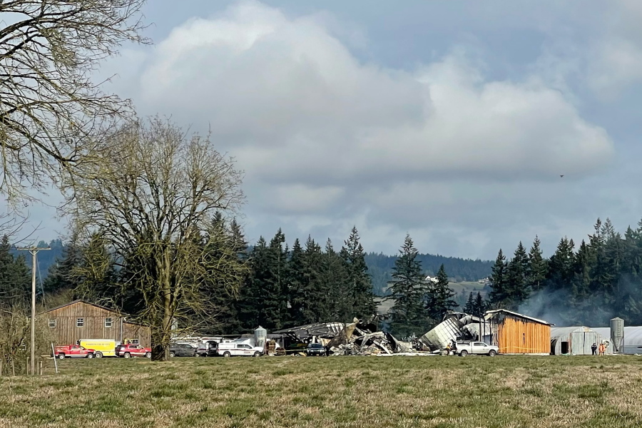 In this provided by Sgt. Jeremy Landers of the Marion County Sheriff's office, the wreckage of a Barn near St. Paul, Ore., smolders on Thursday, Feb. 3, 2022, after a fire and explosion destroyed it. A firefighter was critically injured in the explosion and has been airlifted to a hospital. Investigators were at the scene to determine the cause of the fire and explosion. (Sgt.