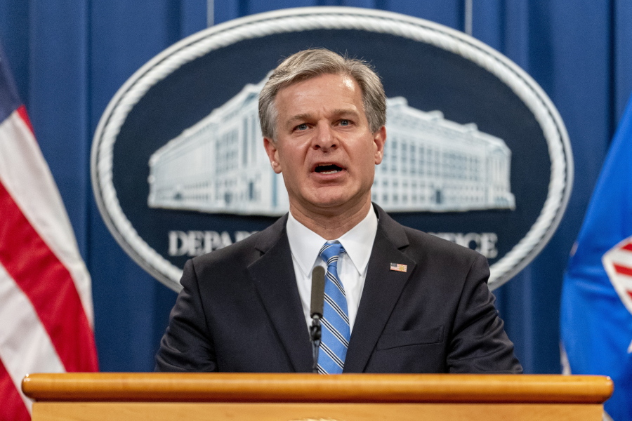 FILE - FBI Director Christopher Wray speaks at a news conference at the Justice Department in Washington, on Nov. 8, 2021. Wray says the threat to the West from the Chinese government is "more brazen" and damaging than ever before. In a speech on Jan. 31, 2022, at the Reagan Presidential Library in California, Wray accused Beijing of stealing American ideas and innovation and launching massive hacking operations.