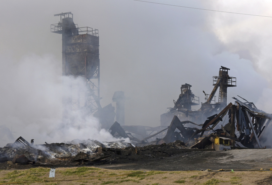 The Winston Weaver Co. fertilizer plant in Winston-Salemm N.C., continues to burn, Wednesday, Feb. 2, 2022, after the fire started Monday night. Fire officials said they could not predict when the blaze might die down. And they didn't know how many people have actually obeyed the evacuation order.