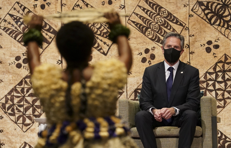U.S. Secretary of State Antony Blinken watches a cultural farewell ceremony in Nadi, Fiji, Saturday, Feb. 12, 2022.
