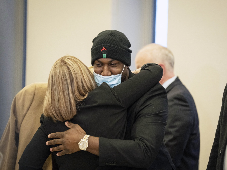 George Floyd's brother Philonise Floyd hugs members of the U.S. attorney's prosecution team after former Minneapolis police officers J. Alexander Kueng, Thomas Lane and Tou Thao were found guilty of violating George Floyd's civil rights at the Federal Courthouse on Thursday, Feb. 24, 2022 in St. Paul, Minn.