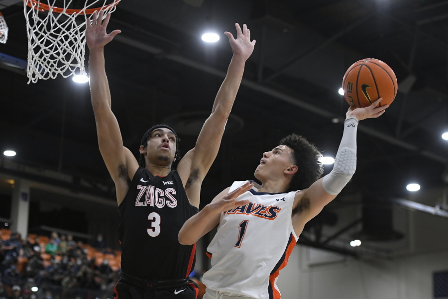 Gonzaga guard Andrew Nembhard (3) defends against Pepperdine guard Mike Mitchell Jr. (1) during the first half of an NCAA college basketball game Wednesday, Feb. 16, 2022, in Malibu, Calif.