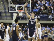 Gonzaga center Chet Holmgren (34) celebrates after making a three-point basket against San Diego during an NCAA college basketball game Thursday, Feb. 3, 2022, in San Diego.