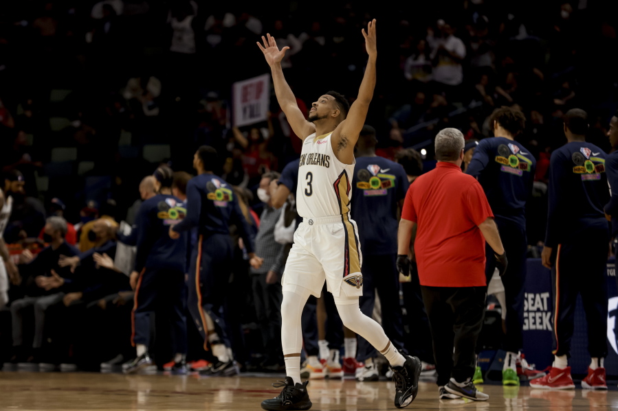 Recently acquired Pelicans' guard CJ McCollum (3) acknowledges the fans as he steps onto the court for the first time in New Orleans prior to tip off against the Miami Heat on Thursday.