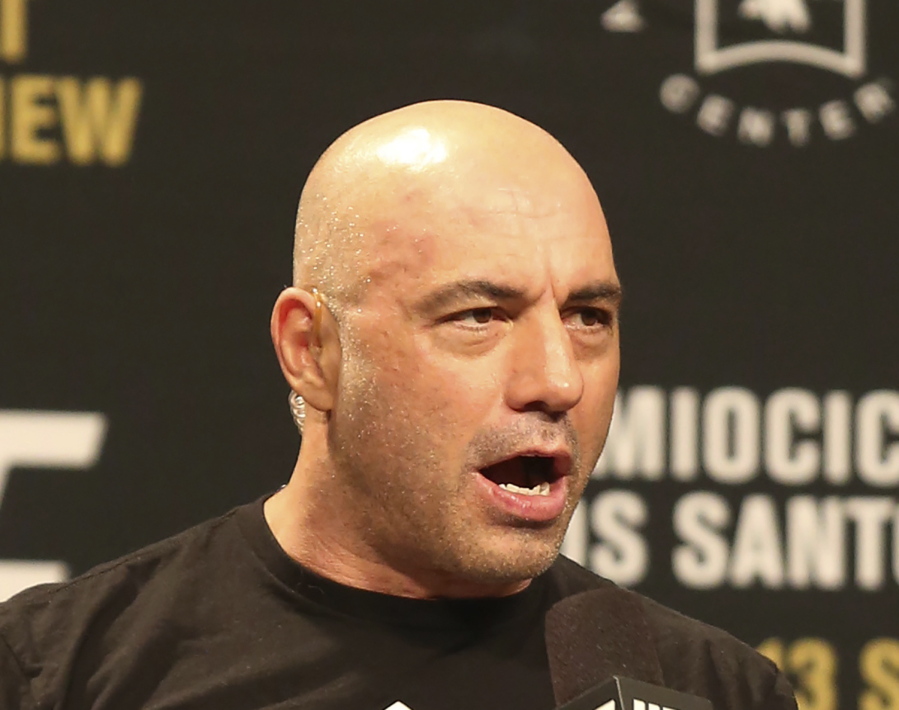 FILE - Joe Rogan is seen during a weigh-in before UFC 211 on Friday, May 12, 2017, in Dallas before UFC 211.  Spotify's popular U.S. podcaster has apologized after a video compilation surfaced that showed him using racial slurs in clips of episodes over a 12-year span. In a video posted on his Instagram account on Saturday, Feb.