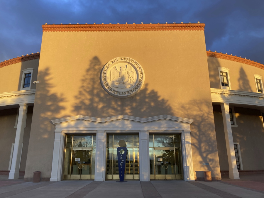Afternoon sun shines on the New Mexico state Capitol building in Santa Fe, N.M., on Dec. 10, 2021. The state Legislature is scheduled to convene on Tuesday, Jan. 18, 2022, to consider critical decisions on spending, voting access, public education and criminal justice.