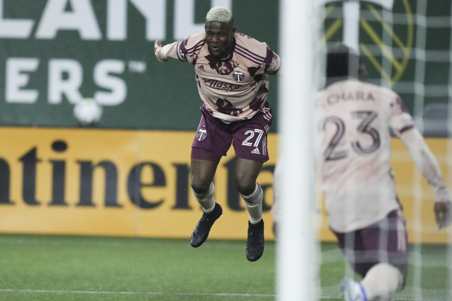 Portland Timbers midfielder Dairon Asprilla (27) celebrates after scoring a goal against the New England Revolution during the second half of an MLS soccer match, Saturday, Feb. 26, 2022, in Portland, Ore.