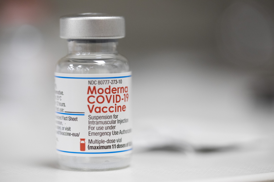 A vial of the Moderna COVID-19 vaccine is displayed on a counter at a pharmacy in Portland, Ore., Monday, Dec. 27, 2021. U.S. regulators have granted full approval to Moderna's COVID-19 vaccine after reviewing additional data on its safety and effectiveness. The decision Monday, Jan. 31, 2022 by the Food and Drug Administration comes after many tens of millions of Americans have already received the shot under its original emergency authorization. Full approval means FDA has completed the same rigorous, time-consuming review for Moderna's shot as dozens of other long-established vaccines.