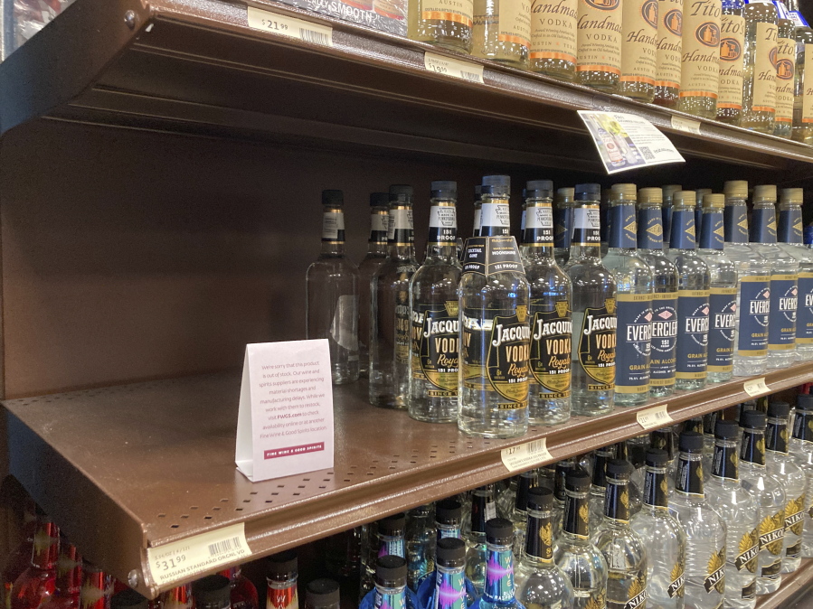 A shelf is emptied of Russian Standard Vodka at a Fine Wine & Good Spirits liquor store in Dresher, Pa., on Monday. Pennsylvania ordered the removal of Russian-made products from state-owned liquor stores.