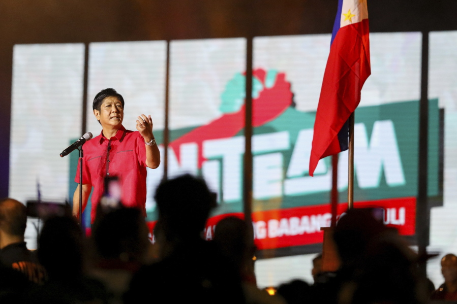 Former senator Ferdinand "Bongbong" Marcos Jr. speaks to supporters during his proclamation rally promoting his presidential bid for the 2022 national elections, at the Philippine Arena, Bulacan province, north of Manila, Philippines, Tuesday, Feb. 8, 2022. Campaigning in the Philippines' presidential election started Tuesday with a cast of candidates led by a late dictator's son and the pro-democracy current vice president, with all vowing to bail out a country driven deeper into poverty by the pandemic and plagued by gaping inequalities and decades-long insurgencies.